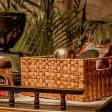 Load image into Gallery viewer, Image of a wicker single checks basket with a unique weave pattern and sturdy metal frame. The basket has a natural woven texture and side slots for easy handling