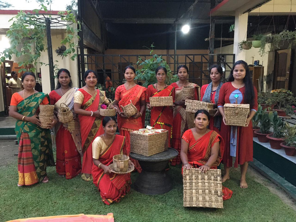 The Asama artisans of Alimur village standing together with the baskets they wove