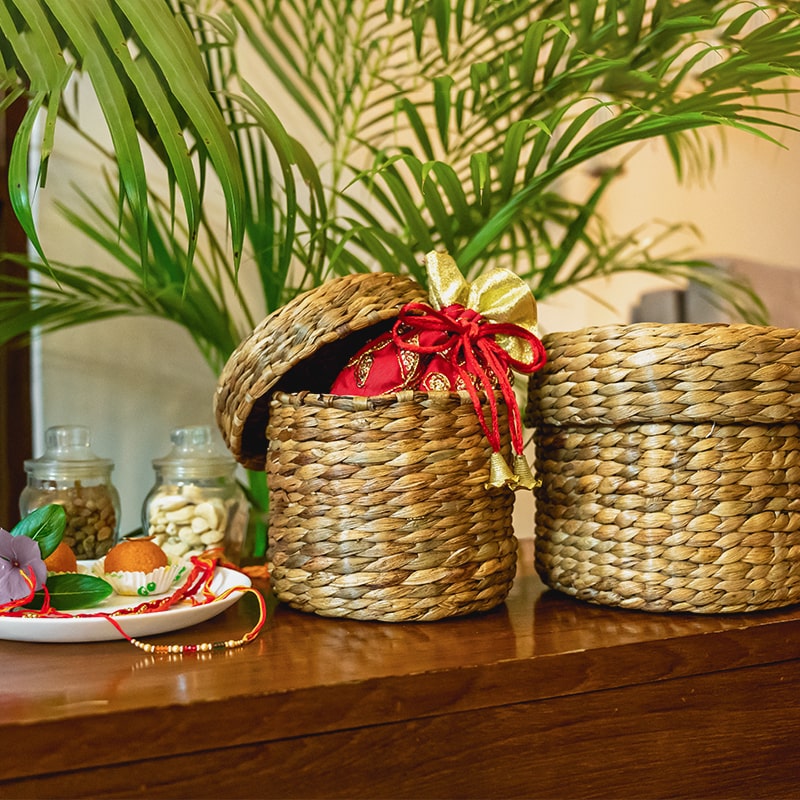 Image of a small wicker round container with a fitted lid and a lovely weave, perfect for storing small items or gifting treats