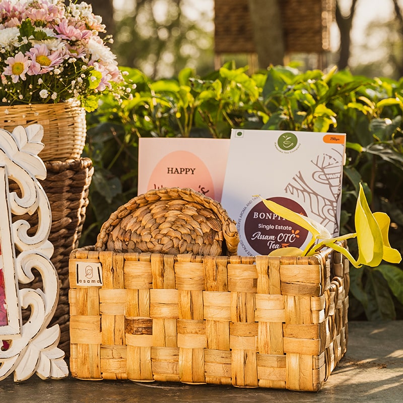 Image of a wicker double checks basket with a unique weave pattern and sturdy metal frame. The basket has a natural woven texture and side slots for easy handling