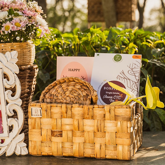 Image of a wicker double checks basket with a unique weave pattern and sturdy metal frame. The basket has a natural woven texture and side slots for easy handling