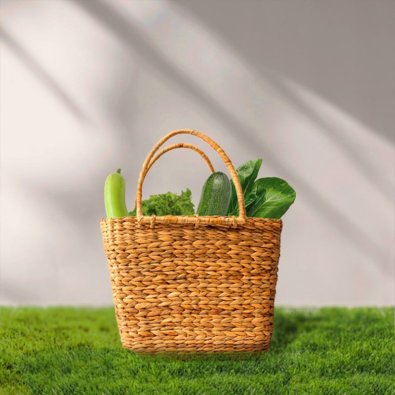Image of a wicker shopping bag with a cane handle, perfect for carrying groceries and vegetables with ease
